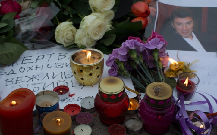 Flowers and candles left at the site of Nemtsov's murder, Wikipedia. 